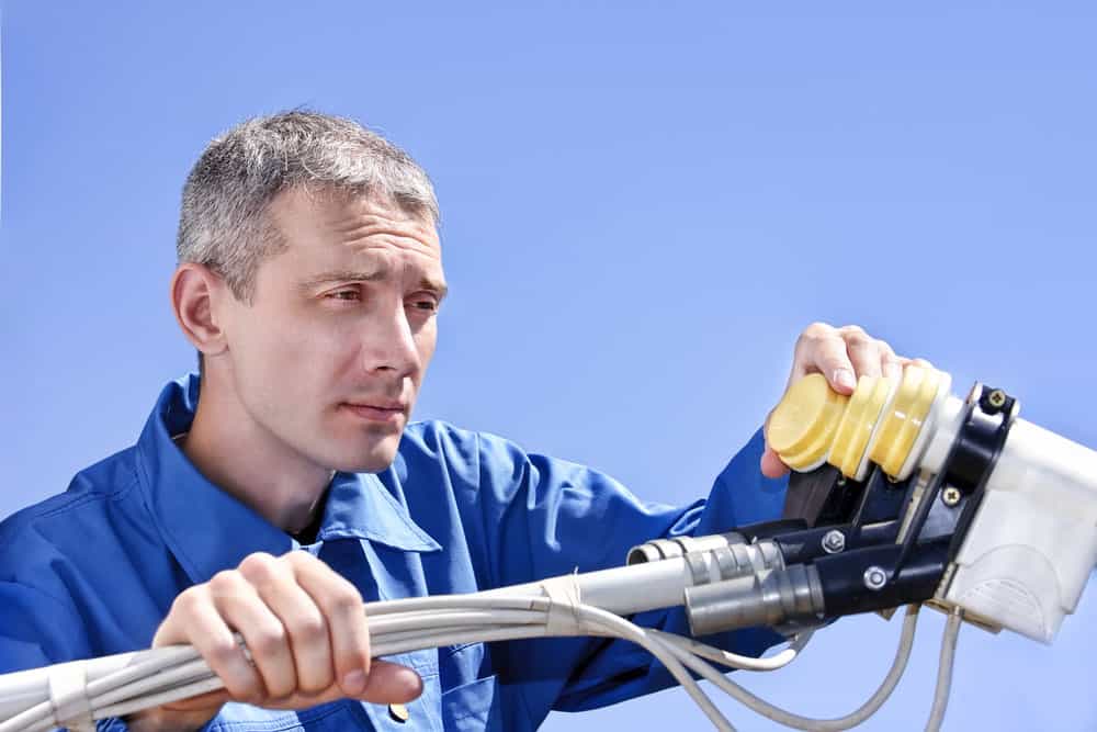 An expert working on installing an antenna setup
