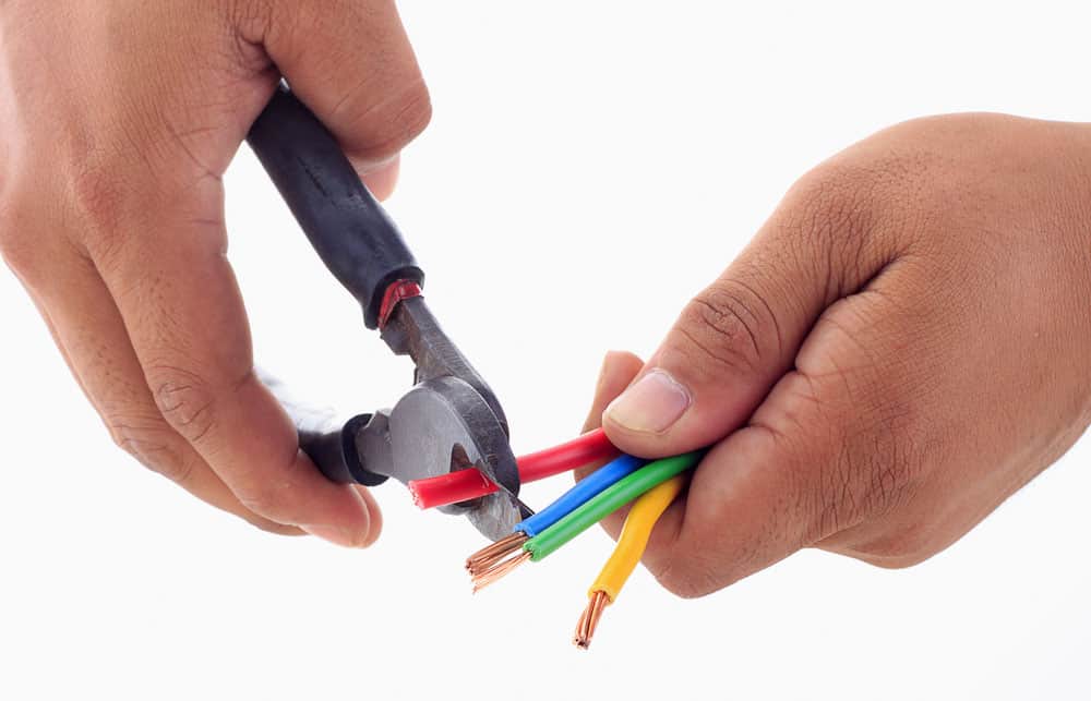 A man using a wire cutter