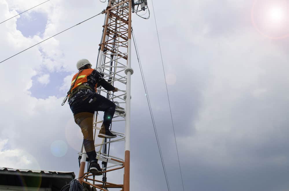 Man working on High electrical Pole