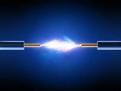 Electrical spark between two insulated copper wires.
