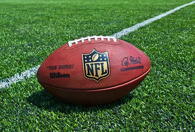 NFL football (The Duke) on the field.
