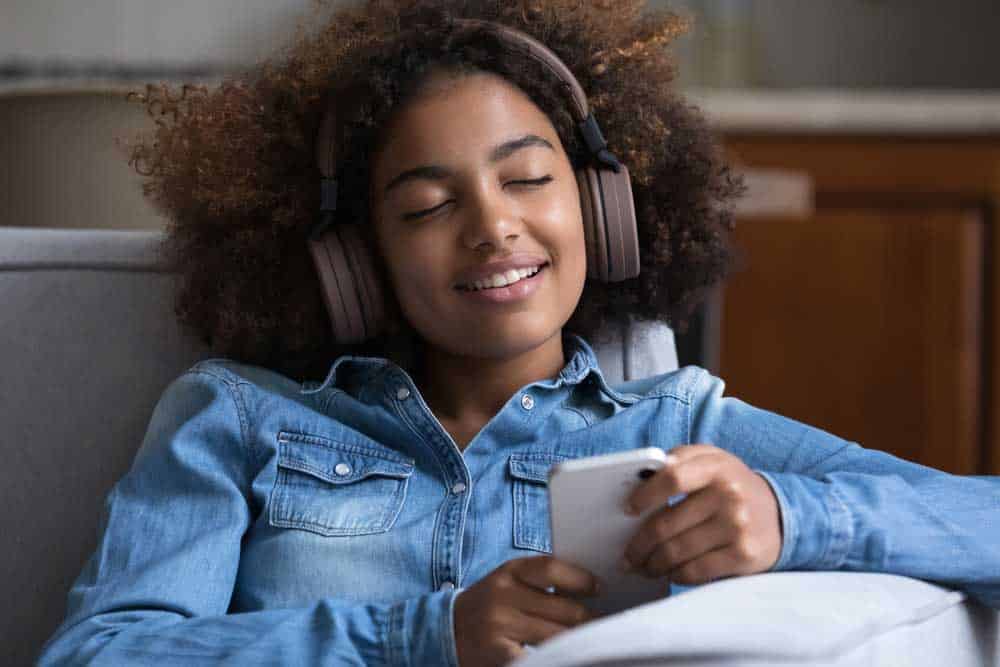 Lady listening to music on headphones