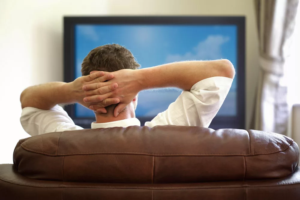 A person watching cable TV