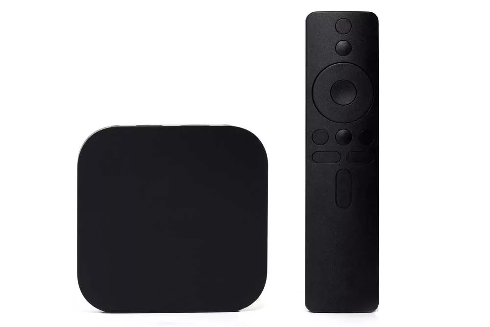 TV box with its remote on a white background