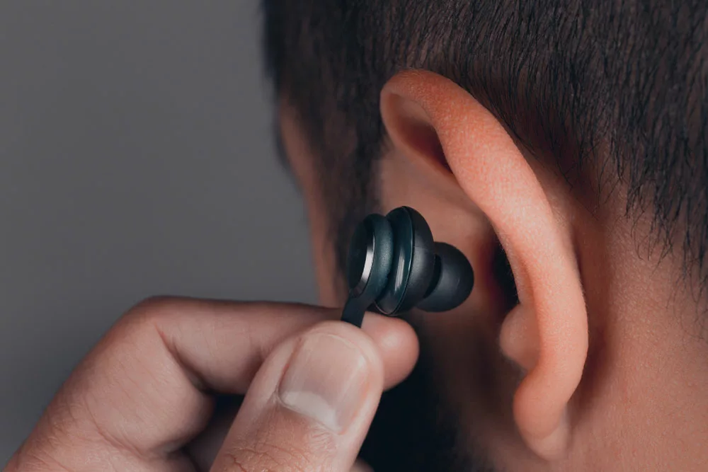 Man with earphones in the ear