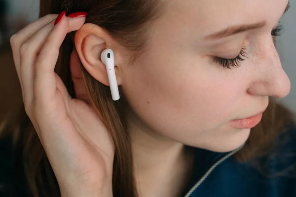 You can utilize various methods to keep AirPods in your ears while sleeping.