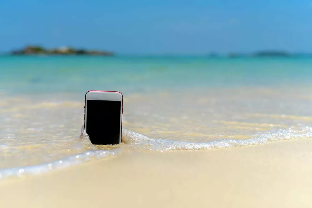 Phone in beach water