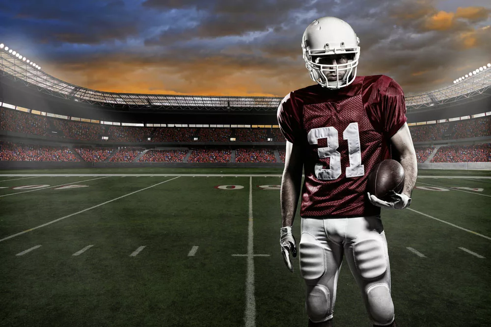 NFL Football Players Wears Basic Equipment, Including Shoulder Pads, Helmets, Shoes, and Gloves.