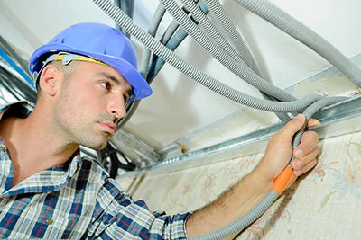 Electrician wiring a house