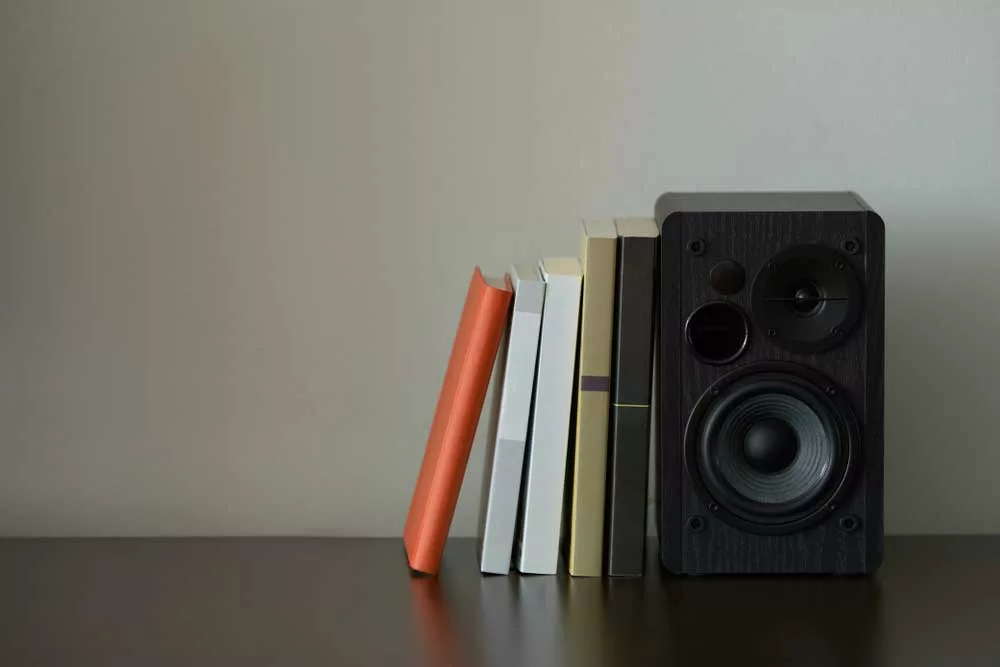 Bookshelf speaker next to books