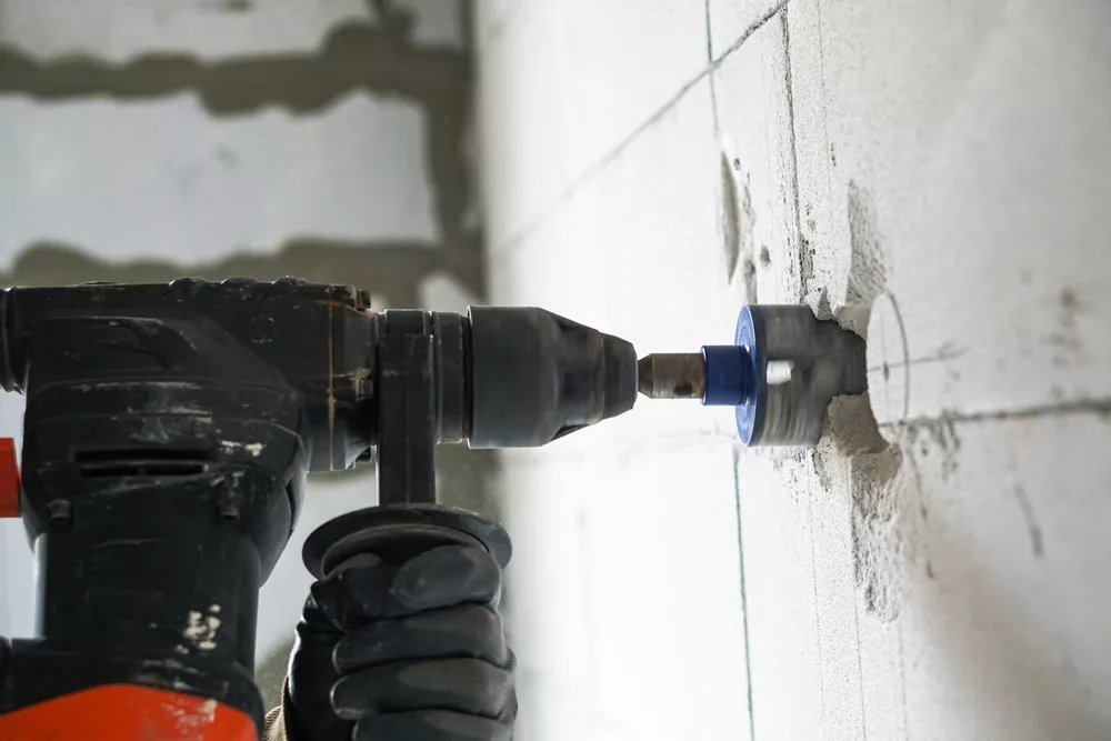 Drilling hole outlets using an electric drill