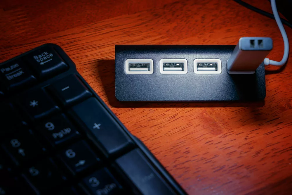 Active USB cable is now a common way to connect two devices, whether to transfer data or charge the devices. However, their maximum length might not be up to your length requirement. You will need to extend these cables to overcome the flaw, which is why an active USB cable comes into use. Let us dive into it.
-Picture-
Caption: USB cable with Laptop
USB Standards, Speeds, and Cable Length Limits
USB wires were first made to connect the peripherals devices with a personal computer like a mouse, keyboard, printer, and external hard drives. Since these devices are always near the PCs, you can easily use shorter USB cables to link them. Over time, cable found its uses in other areas, and requirements are now quite different from the past.
For instance, you have seen or may have connected your wall-mounted Smart TVs with the laptops across the room using a USB cable, or you might be attaching cameras and other gadgets to record a live show, etc. Either way, the current USB wire length might limit your connectivity, and you will need extenders and connectors.
Here is a table of basic USB standards and recommended cable lengths.
USB Specification
Maximum Data Transfer Rate
Recommended Cable Length
USB 1.0 (Full-Speed)
12 Mbps
3 m or 9 feet
USB 2.0 (High-Speed)
480 Mbps
5 m or16 feet
USB 3.2 1st generation
5 Gbps
2 to 3 m or 6 to 9 feet
USB 3.2 2nd generation
10 Gbps
3 m or 9 feet
USB 3.2 2 by 2 generation
20 Gbps
3 m or 9 feet
USB4 (USB type C only)
40 Gbps
0.8 m or 31 inches
Why do USB Cables Have a Maximum Length?
Manufacturers have to create shorter USB wires since the greater the length, the greater will be the problems in the signal transfer. The following are the two main reasons for their maximum length limit.
Communication protocols
Using the duplex signal method, the communication protocols transfer data from one point to another via Ethernet or USB wires. Furthermore, the devices that follow the duplex protocol can communicate with each other in both ways. This phenomenon works in the following way: one device sends the data packet to the other and waits for its reply. If there is no response from the receiver, the sender again tries to connect and send the packet.
As the data transfer rate is increasing due to high-speed internet demand, the devices have to communicate with each other much more rapidly than before. The greater the length, the greater the time to send and receive the packets; hence, the error of "late collision" occurs. Engineers use shorter USB cables to overcome the problem to ensure a high data transfer rate.
The Conductivity of Copper Cabling
Another reason for the cable length limit is the conduction of copper wire. As the signals travel along the conductor, they start to weaken. The attenuation or signal loss during the journey increases with the distance between the start and endpoint. Moreover, the farther the signal travels, the higher the signal loss, and you are left with undetectable noise.
You can use large gauge wires and proper insulation and shielding to lessen the distortion and signal loss. Also, you have to prefer shorter cables, so the signals don't have to travel farther than a specific distance.
-Picture-
Caption: USB cable type 4
5 Ways to Beat USB Cable Length Limitations
Distortions can occur in a larger USB cable leaving you with a poor signal. But, you can minimize the effect using the following techniques.
Buy a Passive USB Cable
A simple or passive USB cable has USB connectors at both ends. Also, there is no extra phenomenon happening that will help the signals to boost the traveling signals. Thus, the problem of signal degradation remains.
However, using a thick passive cable with proper insulation and shielding might go beyond the length limit and still perform well. So these cables are an acceptable option if you have a limited budget.
Use an Active USB Cable
Active USB cables are hubs with one USB port with signal regeneration circuitry. Thus, one can say that these are signal boosters you can place along the longer lengths of USB cables. The active USB cable has its batteries, but you can use the USB-A connectors and adapters to charge the system during the process. Generally speaking, the active cables are usually bus-powered. However, you should get a separate power battery to ensure they are getting adequate power when the cable is very long.
In addition, you will use these units adhering to these limits.
For USB 2.0 devices: 5 meters or approx. 16 feet long regular cable
For USB 3.0 devices: 3 meters or approx. 10 feet long regular cable.
Purchase USB Hubs
USB Hubs work the same as the Active cable hubs with extension cables. It also calls for distance limits of 5 meters for 2.0 and 3 meters for 3.0 devices. It is since the higher the cable's quality, the higher you will need its data traveling speed.
The USB 2.0, 3.0, and 3.1 devices also need a 7-tier connection setup. The sender, receiver, and USB hub are already counted as three tiers in such a network. After these devices, only four spaces are left. Hence, you can only use 5 USB hubs in a 30-meter or 98 feet of extended network.
Consider USB over Cat5/Cat6 Extenders
USB over Cat5/6 extenders are another one-port hubs that convert the USB signals into Ethernet ones and transmit them over Cat cables. At the receiving point, they reverse the phenomenon and convert the signals back to USB.
These extenders can send signals over 164 feet without distortion, making them an efficient solution for the problem. Remember, it's different from the USB adapter that lets the USB port link with an Ethernet network.
Use USB over Fiber Extenders
These extenders let you install the peripheral devices at any point and are considered the best solution for larger distances. Also, the fiber extenders are compatible with multiple OS like Linux, Windows, and Mac OS. Hence, you can connect your printers, camcorders, scanners, hard disks, speakers, etc., with the USB over Fiber extenders without any problem.
-Picture-
Caption: USB Hubs with memory
Conclusion
USB cables might have a maximum length criterion, but nowadays, you can find many mediums to extend this length for larger distances. Hence, you can purchase extension cables, active USB cables, hubs, or extenders to attach to either side of the cable and increase the length.
Here at Cloom, we offer wiring harness solutions and custom cable assemblies to meet your need. To get the work done, contact us now.