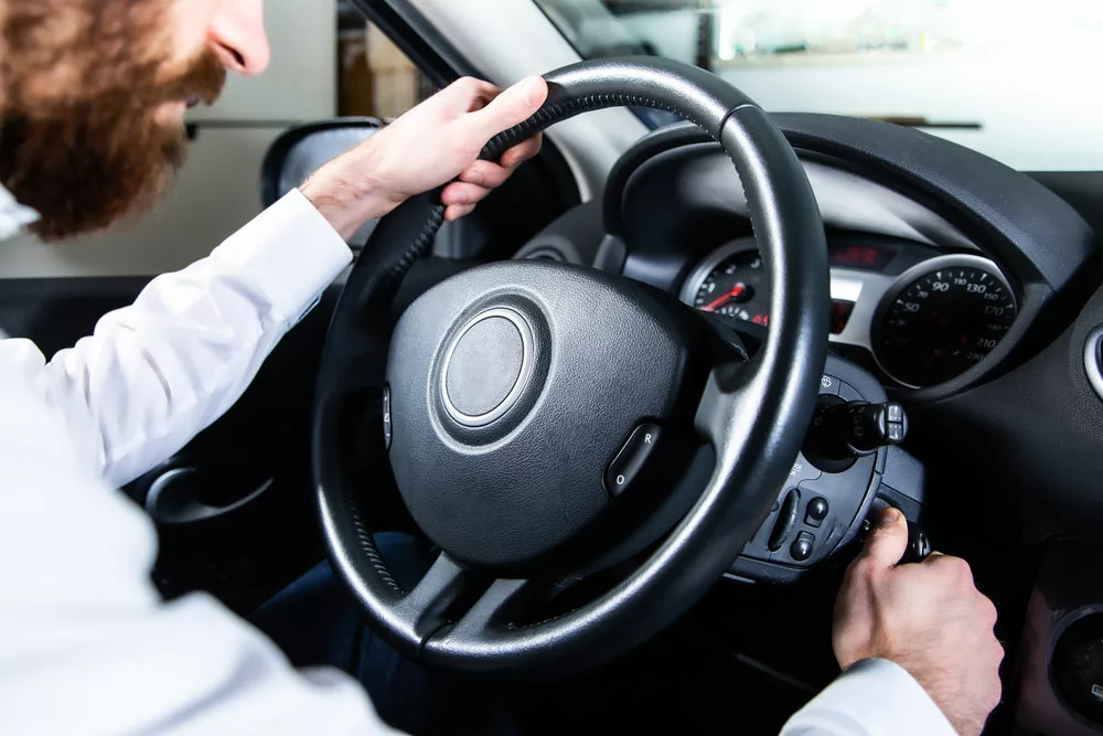 A driver attempting to start a car