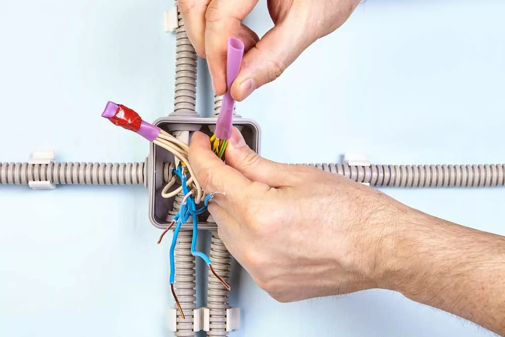 Setting electrical wire heat shrink tubing in place