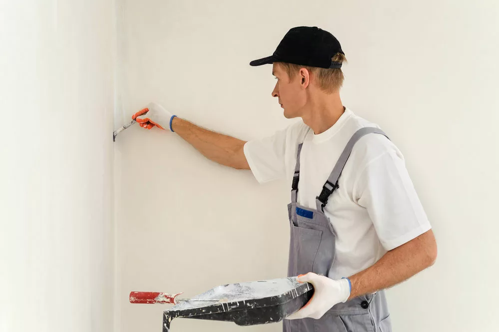 Man painting walls. 