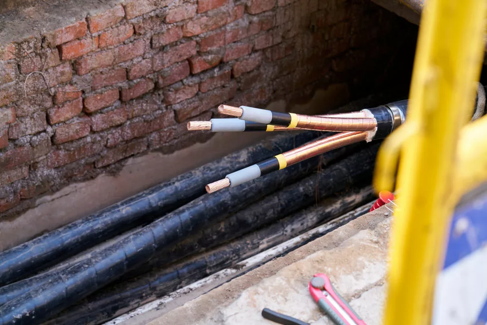 Technician repairs a copper wire