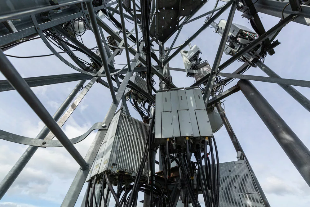 Telecommunication tower with fiber optic cables and equipment