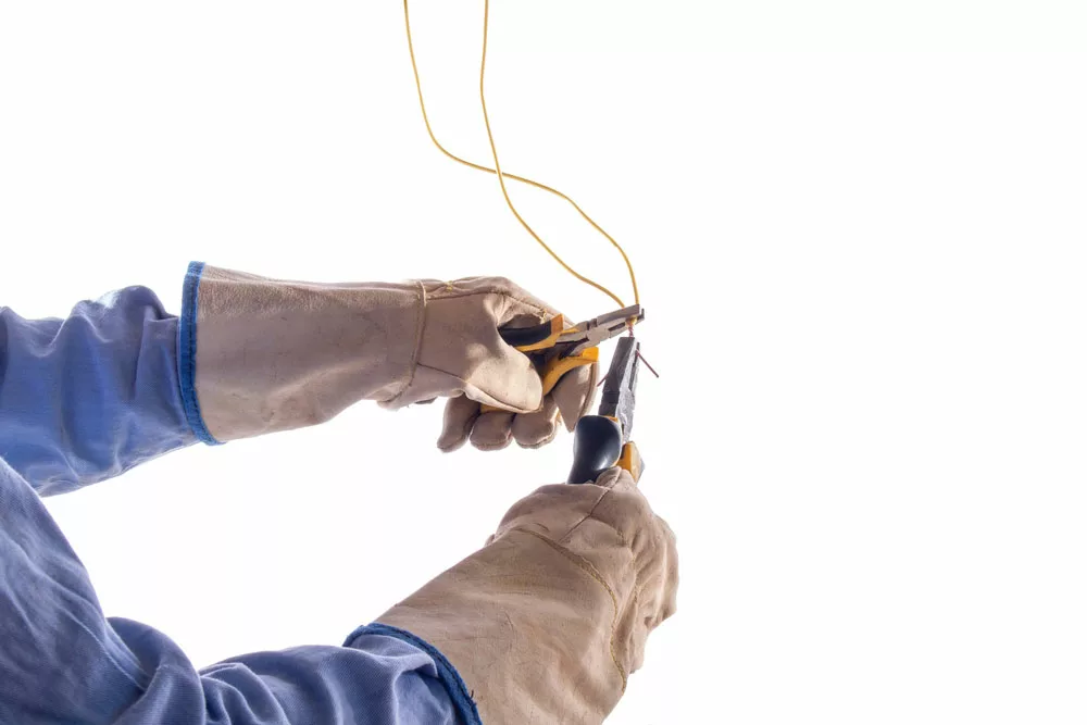 Gloved Hands Splicing Wires Together