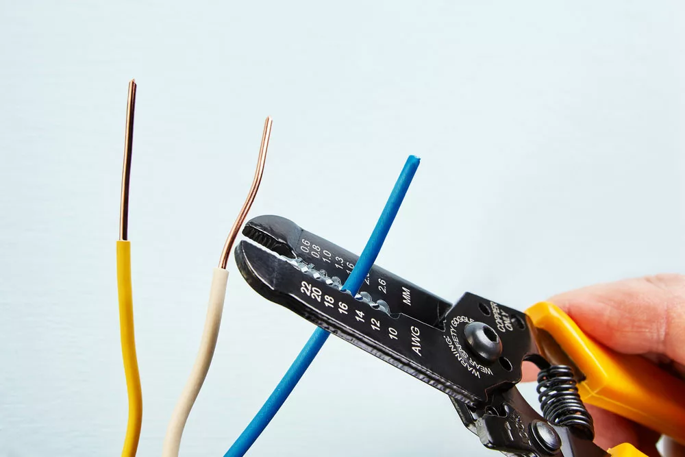 Wires being stripped using a wire stripper