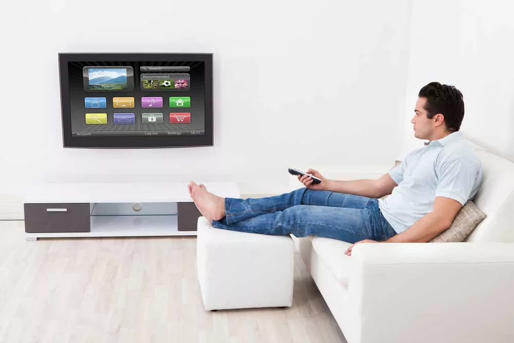 Person setting a TV system