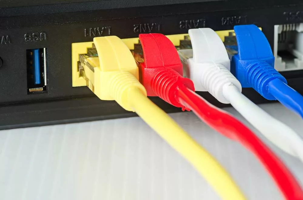 ethernet cables in different colors connected to the router