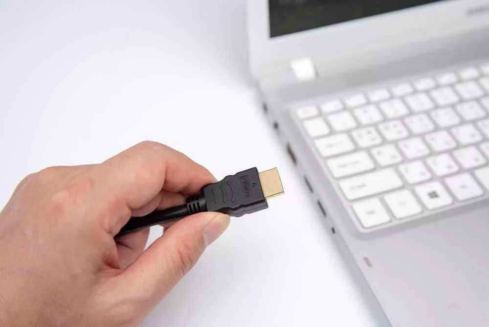 HDMI Cable Connecting To a Laptop
